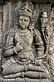 Prambanan, a male Hindu deity in relief panel on the wall of Vishnu temple.